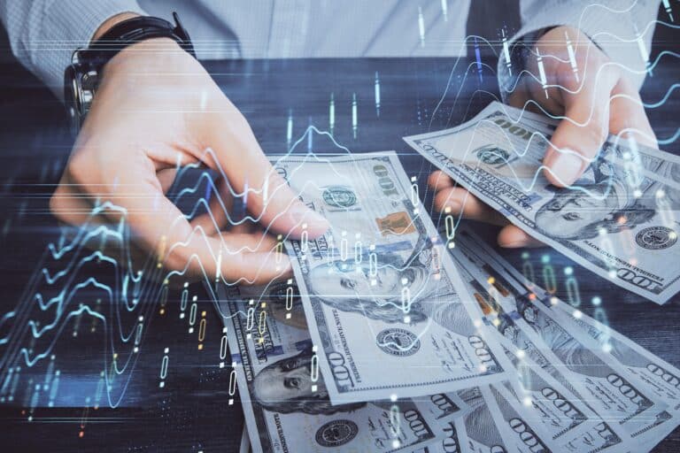 Multiple exposure of financial charts, US dollar bills, and hands drawing. Concept of achieving personal loans.