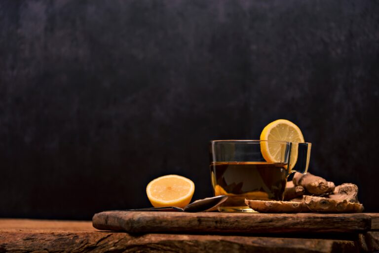 A cup of hot tea with ginger root, lemon, and turmeric, naturally sweetened with raw honey – a Vitamin C drink to naturally boost the immune system.